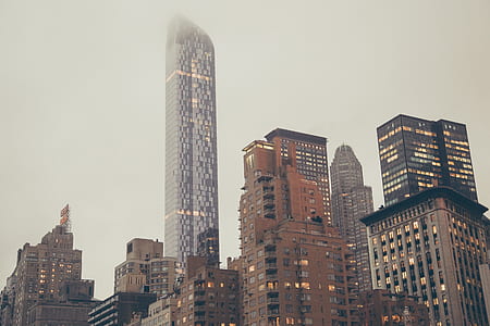 assorted buildings under cloudy sky thumbnail