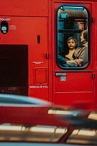 painting of woman and man inside red train thumbnail
