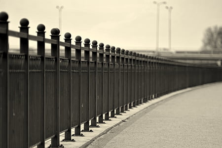 metal fence near three light posts thumbnail