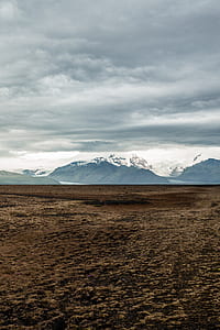 person looking at mountains covered with snow thumbnail