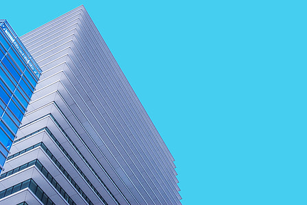 low angle photography of gray shard building under blue sky thumbnail