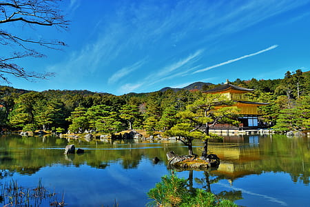 pagoda near river under blue sky thumbnail