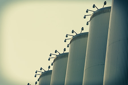 gray metal silos at daytime thumbnail