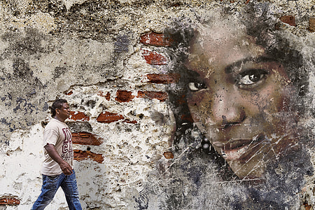 man walking along the wall with woman printed wall thumbnail