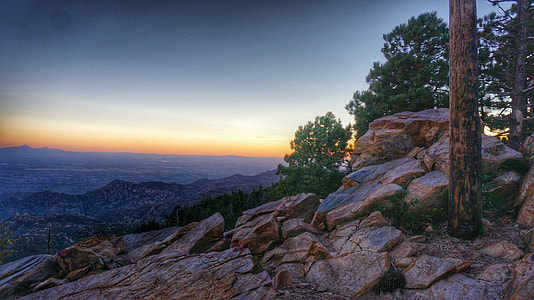 photography of mountain beside trees thumbnail