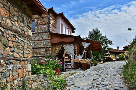 brown brick house at daytime thumbnail