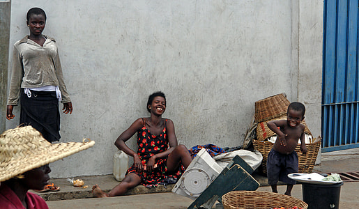 woman sitting beside wall while smilling thumbnail