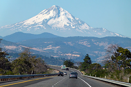 low-angle photography of snow-covered mountain peak thumbnail