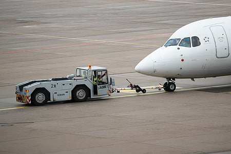 white trailer carrying airplane thumbnail
