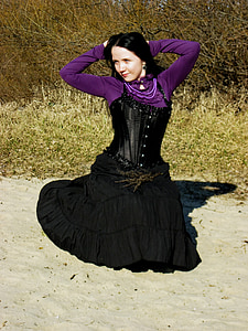 woman kneeling on ground thumbnail
