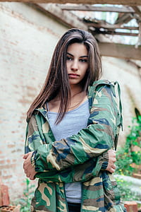 woman in woodland camouflage jacket photo thumbnail