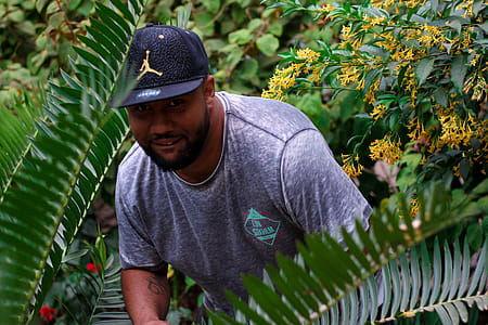 Man Hiding Behind Palm Tree thumbnail