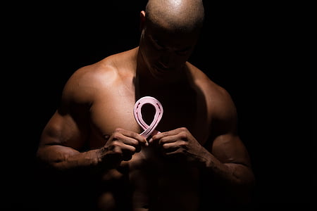 man holding breast cancer awareness ribbon thumbnail
