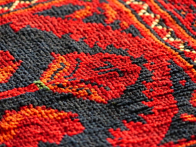 red and black floral textile thumbnail