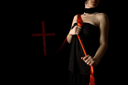 woman wearing black halter dress holding red lace lowlight photography thumbnail