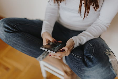 Beautiful young woman using smartphone thumbnail