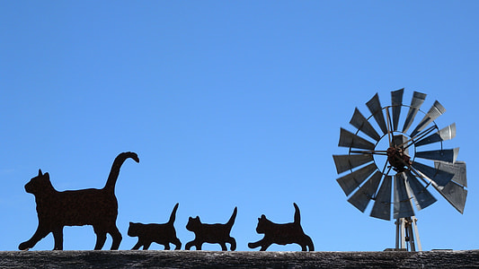 gray windmill with silhouette of cats thumbnail