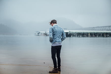man standing on shore thumbnail