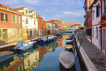 empty boats on water beside pathways thumbnail