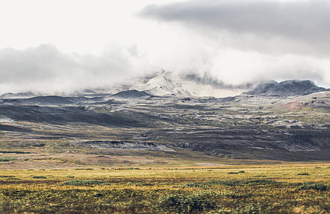 photo of a mountain and cloudy sky thumbnail
