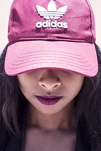 woman wearing pink and white adidas cap thumbnail