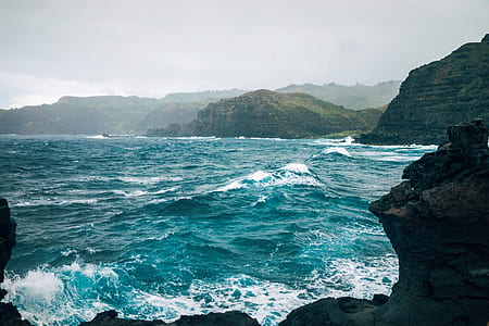 ocean hitting rock formation thumbnail
