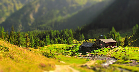 selective focus photography of house near mountain at daytime thumbnail