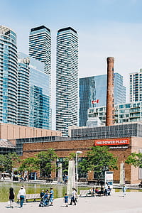 people waking on street near The Power Plant building during daytime thumbnail