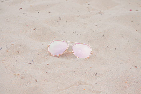 aviator sunglasses with gold frames on sand thumbnail