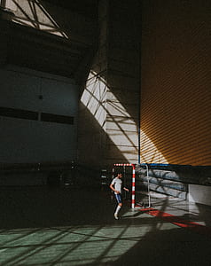 man standing near goalie net thumbnail