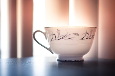 white and black ceramic teacup thumbnail