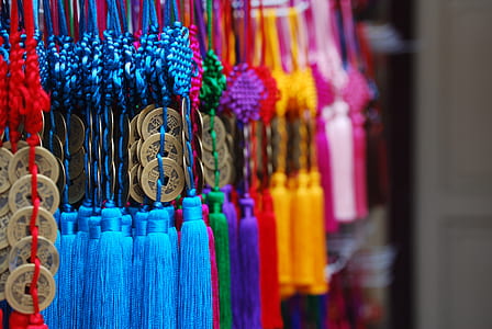 pile of assorted-color tasseled misbaha prayer beads thumbnail