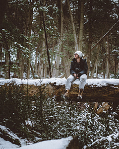 man sitting on tree trunk thumbnail
