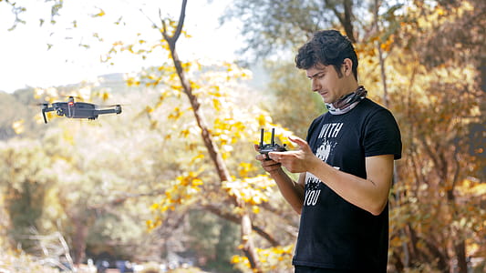 Man Holding Dji Mavic Pro Controller thumbnail