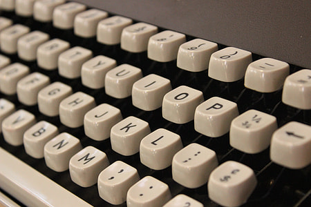 white and gray typewriter close-up photography thumbnail
