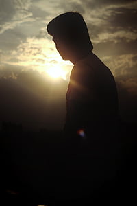 silhouette of man standing thumbnail