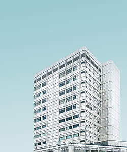 white concrete building closeup photography thumbnail