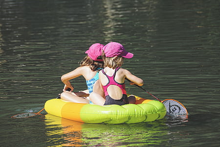 Two Girls in Floating and Paddling Using Badminton Rackets thumbnail
