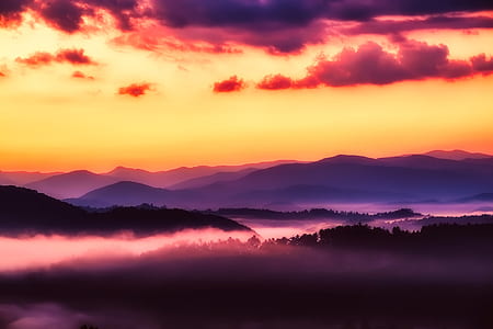 silhouette of mountain range with fog thumbnail