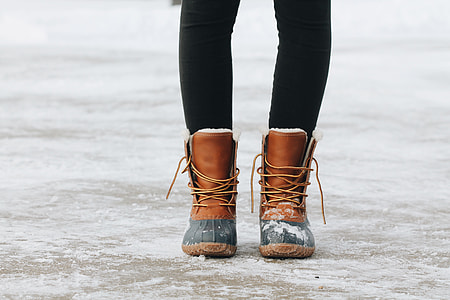 person's wearing brown boots standing thumbnail