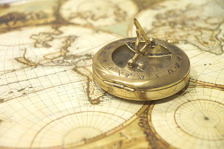 gray steel compass on map closeup phot thumbnail