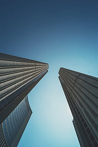 worm's eye view photography of two white buildings during daytime thumbnail