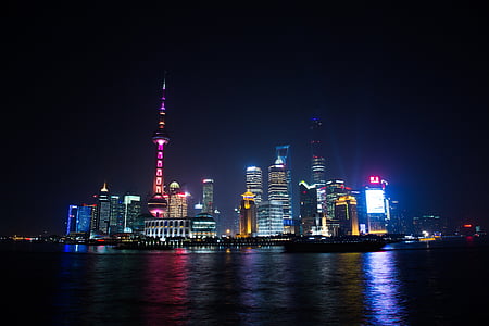 large body of water across Oriental Pearl Tower, Shanghai China at night thumbnail