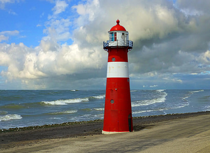 red and white lighthouse on seashore thumbnail