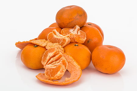 orange fruits on white surface thumbnail