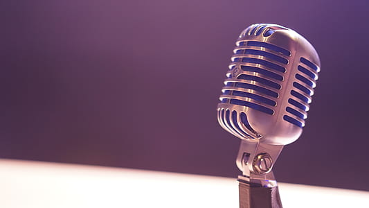 selective focus photography of gray condenser microphone thumbnail