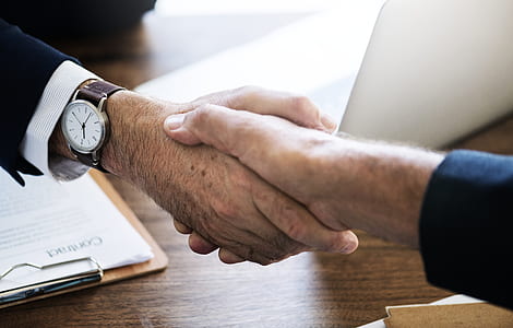 close-up photo of shaking hands thumbnail