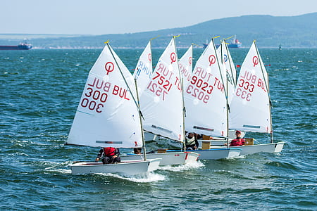 several white sail boats in body of water thumbnail