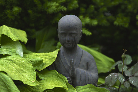 closeup photography of gray monk statue thumbnail