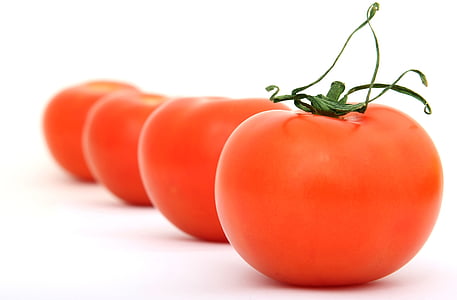 four orange tomatoes thumbnail